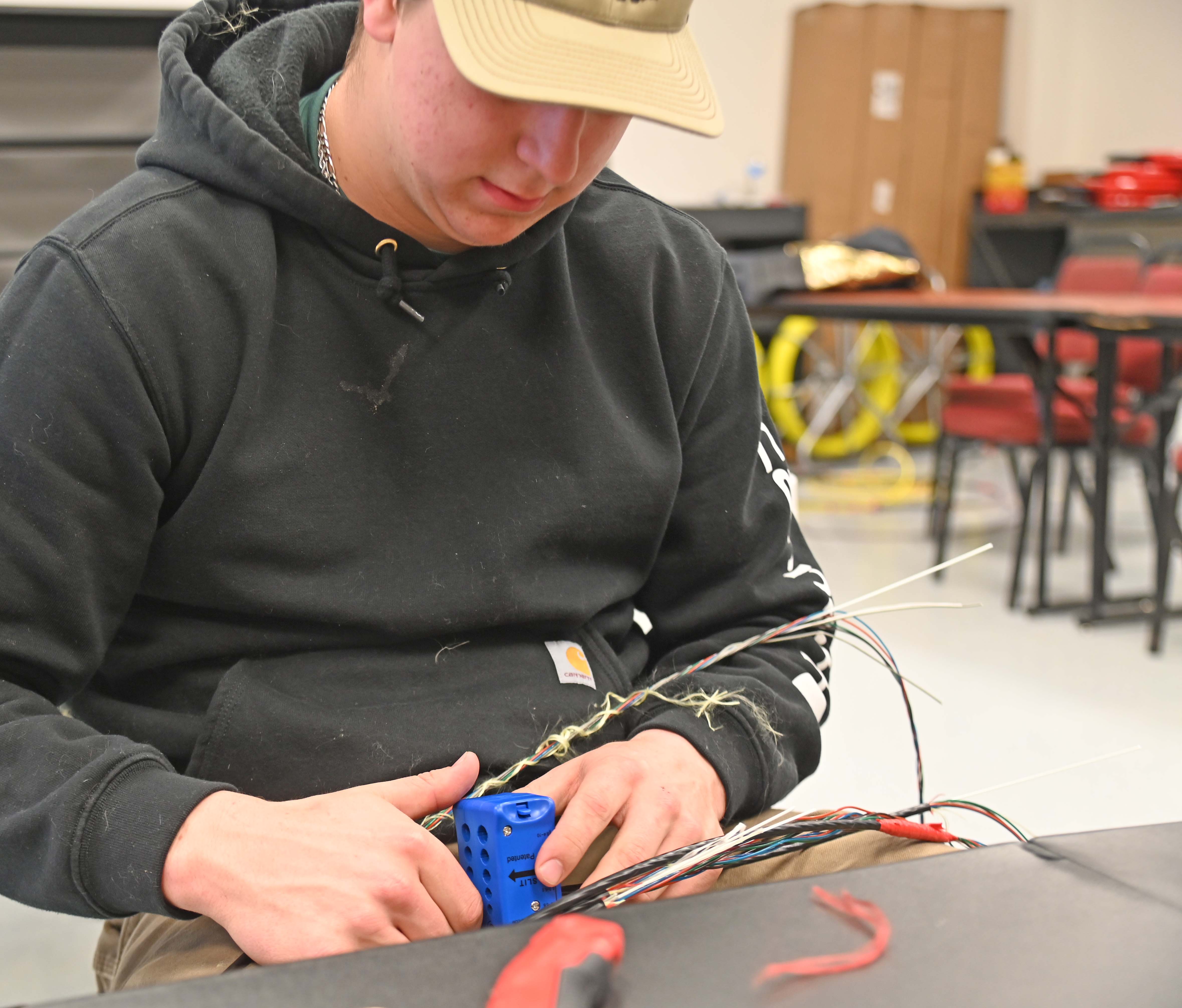 Fiber student working with wires