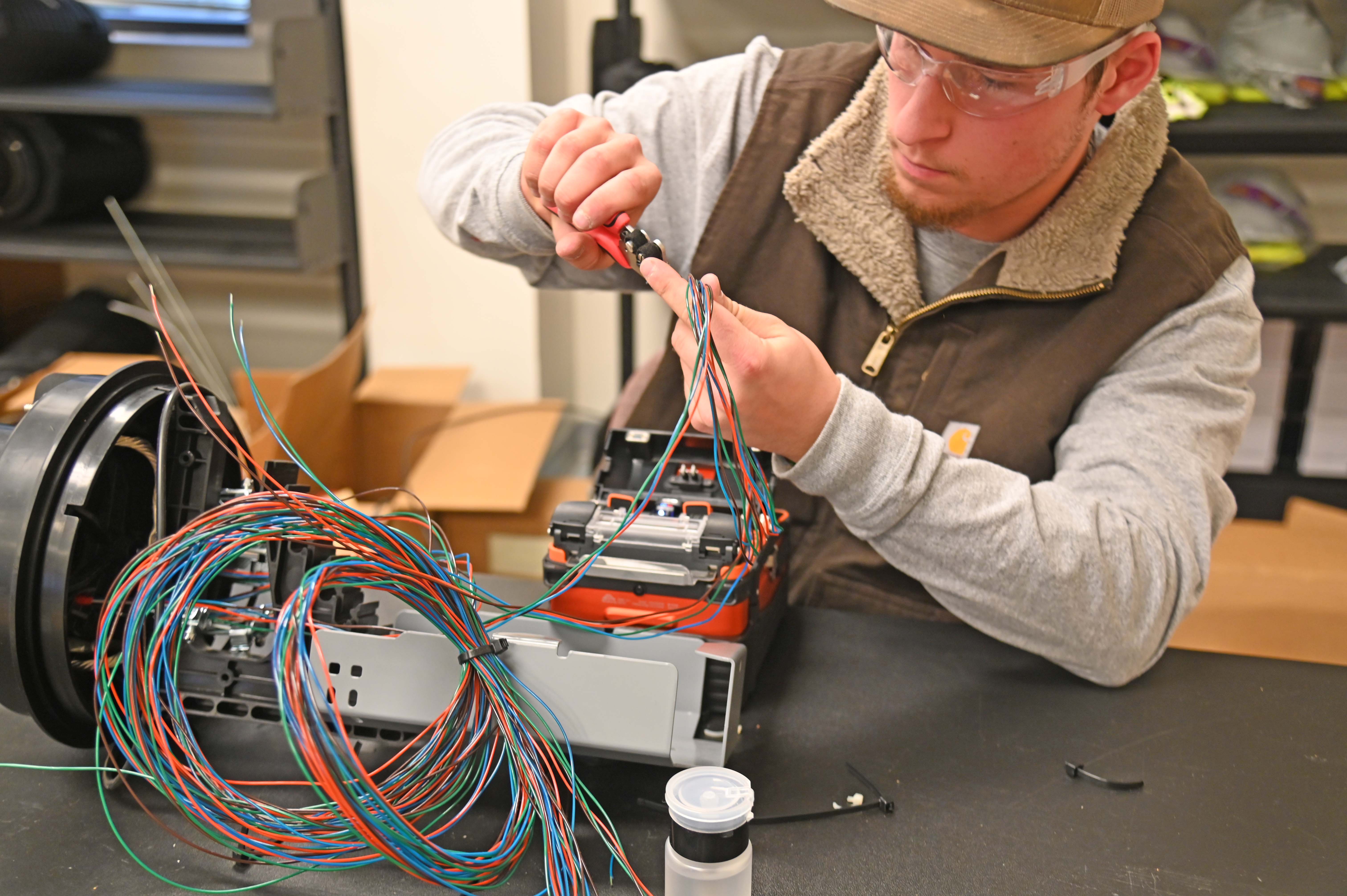 Fiber student working with wires