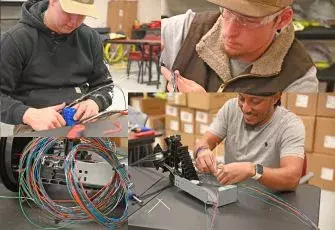 Several fiber students working with wires