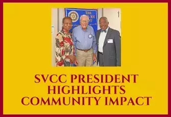Thumbnail of Marva Dunn, Bobby Wrenn, and Dr. Quentin  Johnson standing in front of the Rotary banner